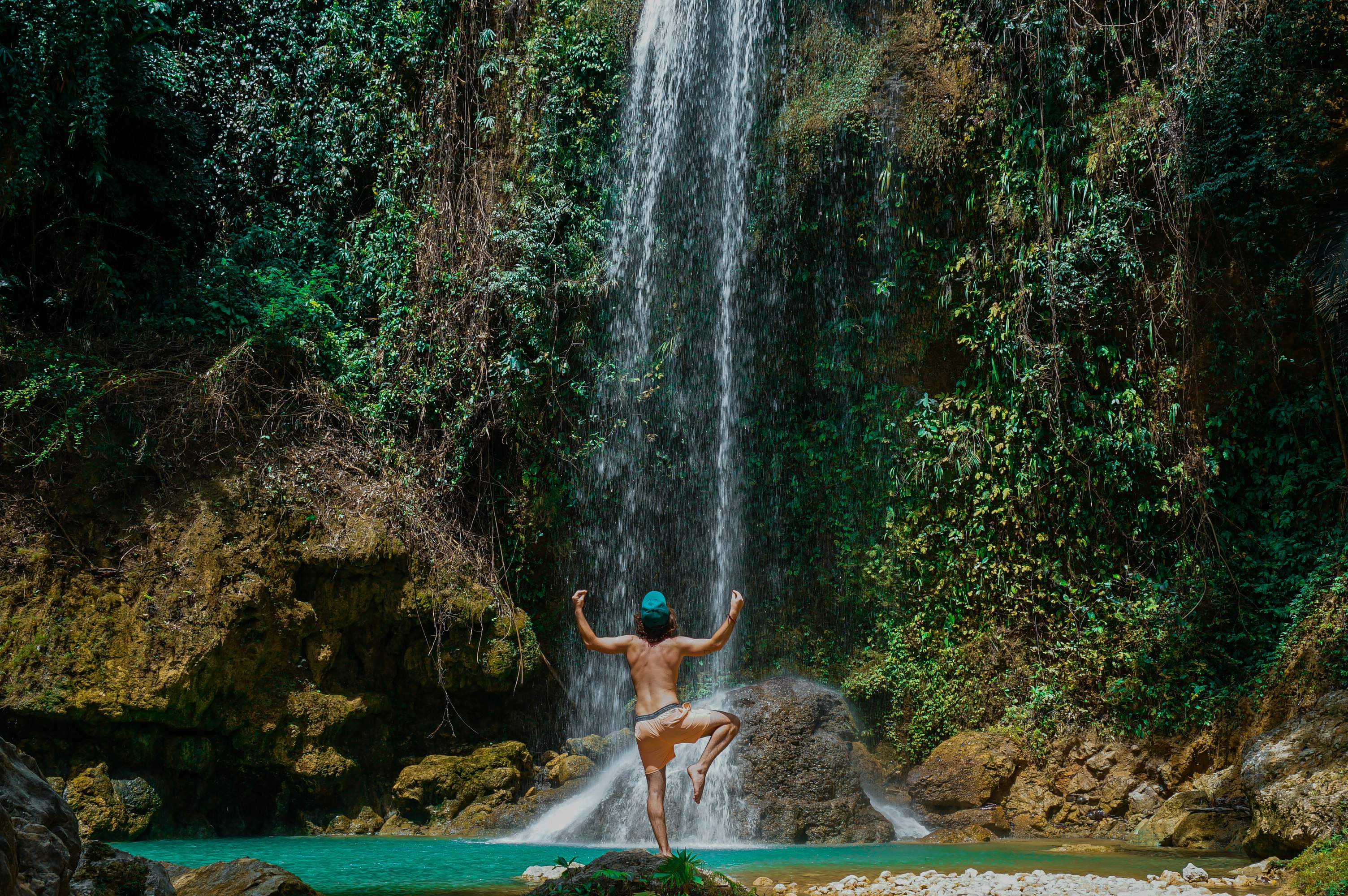 person near waterfalls